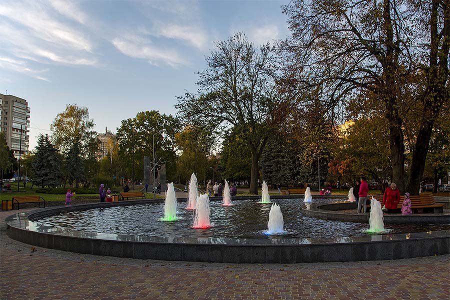 round Public square fountain with bright multicolor lights Public square fountain with bright multicolor lights