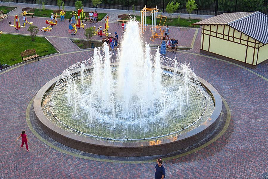 round dancing fountain in city park round dancing fountain