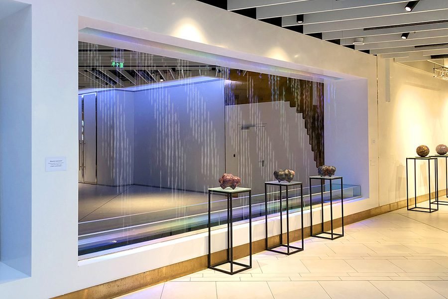 Modern LED Water Curtain for Shopping Mall Interiors Modern indoor water curtain with soft LED illumination in a shopping mall