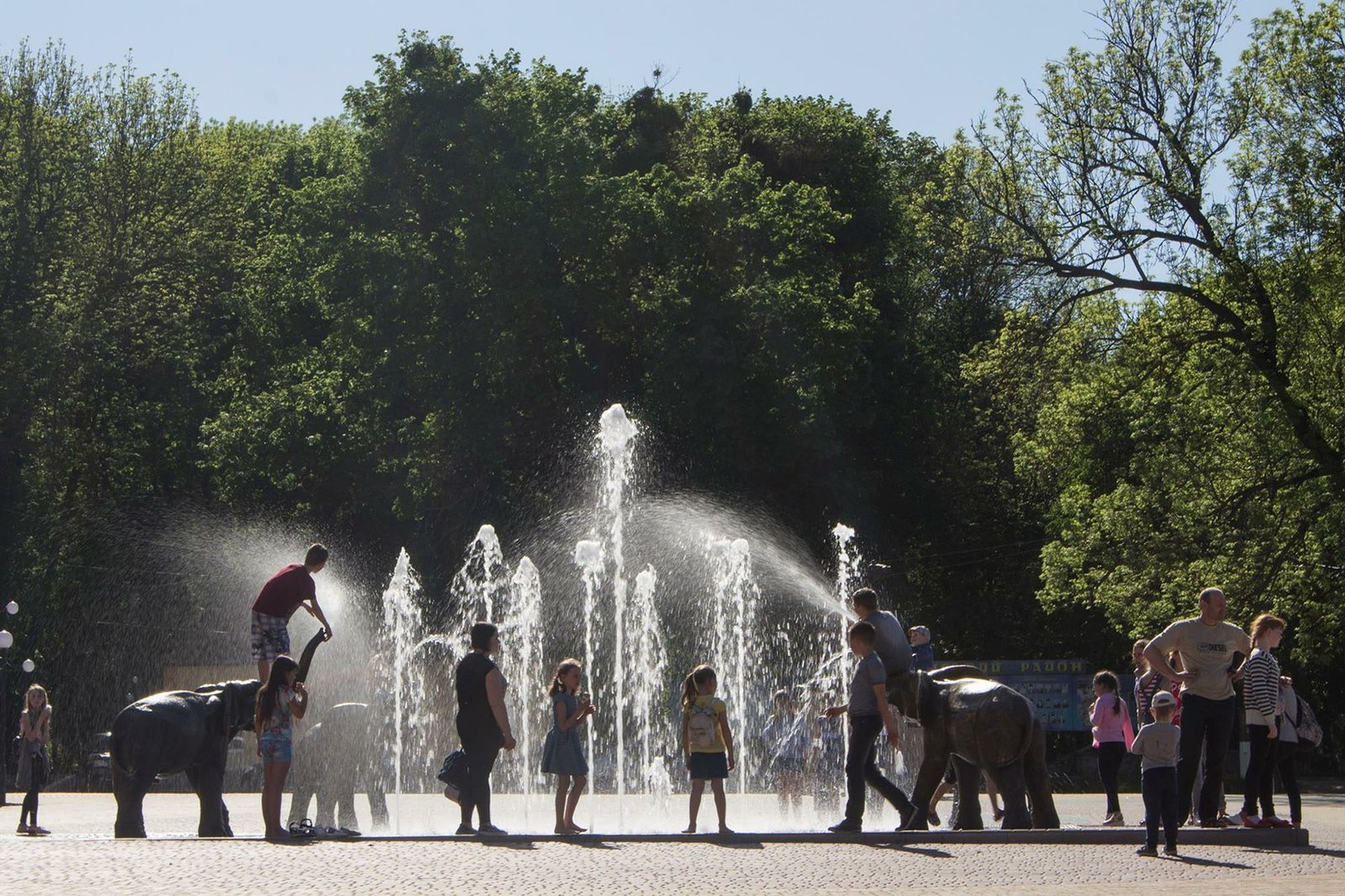 Interactive public splash fountain with sculptural features for urban parks and municipal landscape projects Interactive splash fountain with children and sculptural elements