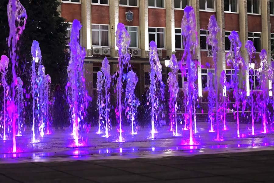 dry deck interactive public fountain dry deck fountain with LED at night