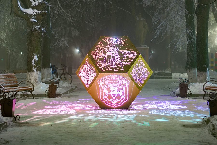LED-lit metal sculpture with perforated ornaments LED-lit metal sculpture with perforated ornaments