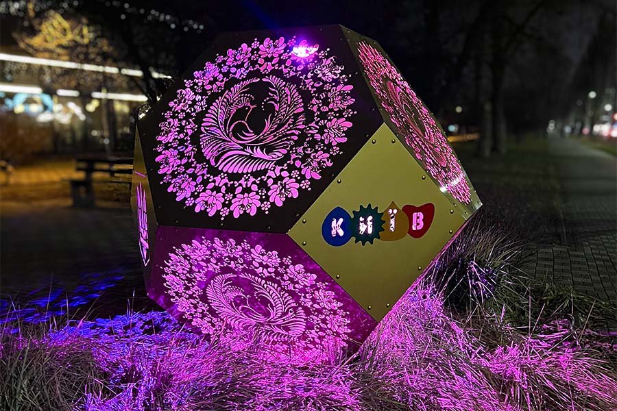 Gold Geometric Sculpture – outdoor perforated metal art installation featuring decorative traditional patterns with integrated light gold geometric metal sculpture outdoor public art installation with integrated light