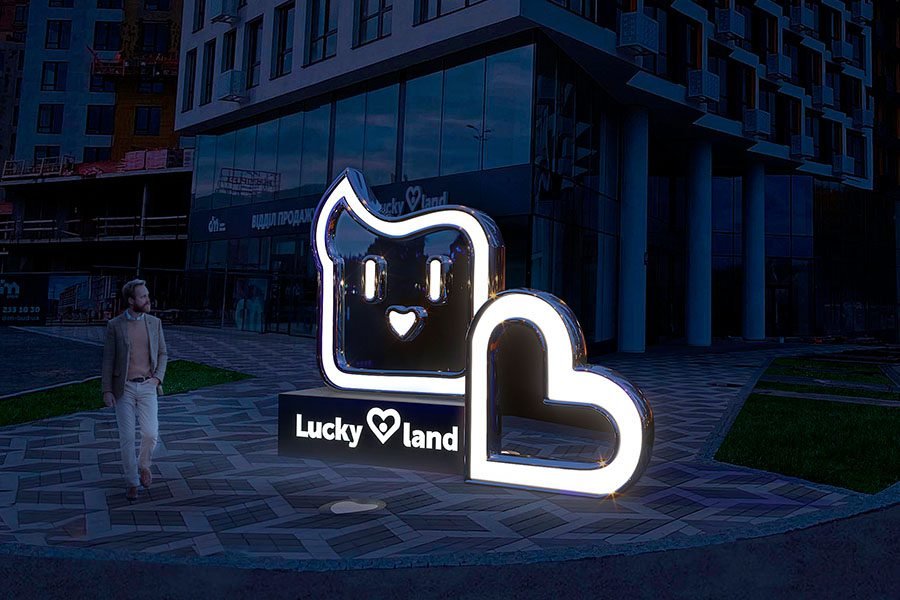 Custom branded LED logo sculpture installed in a modern urban square, serving as illuminated public art and signage custom branded logo sculpture