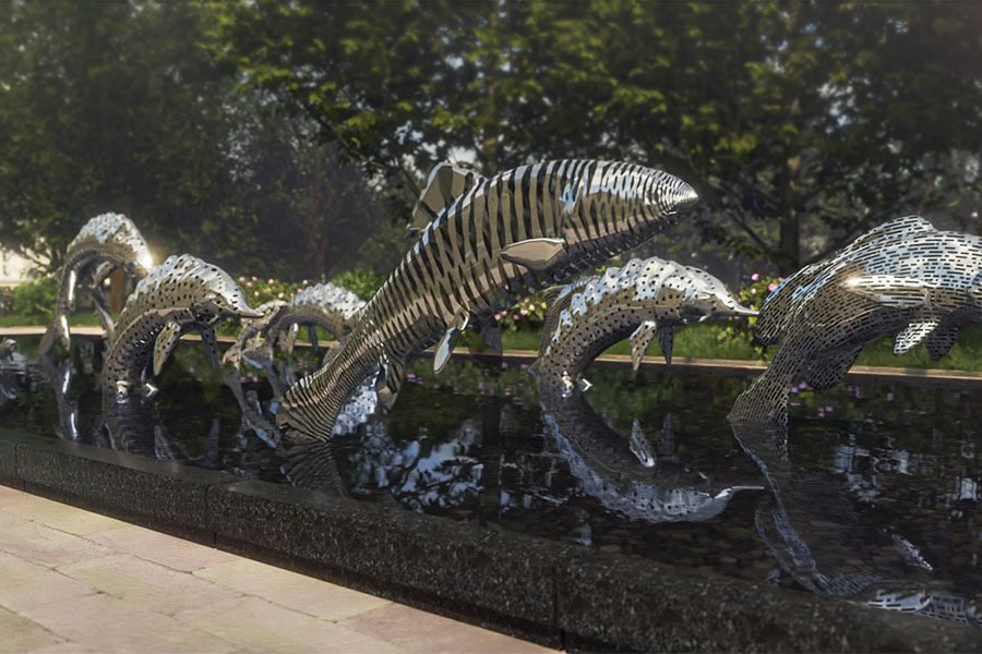 Custom stainless steel fish public art installation in a reflective water pool for urban park stainless steel fish sculpture in water pool