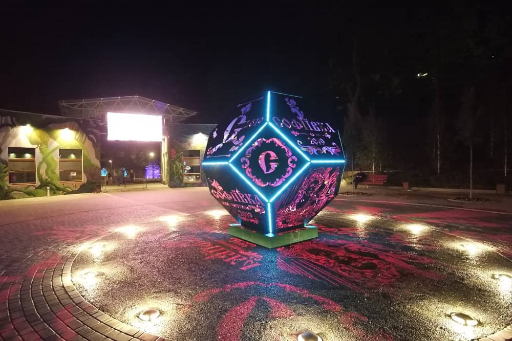 large art installation with lighting in open square