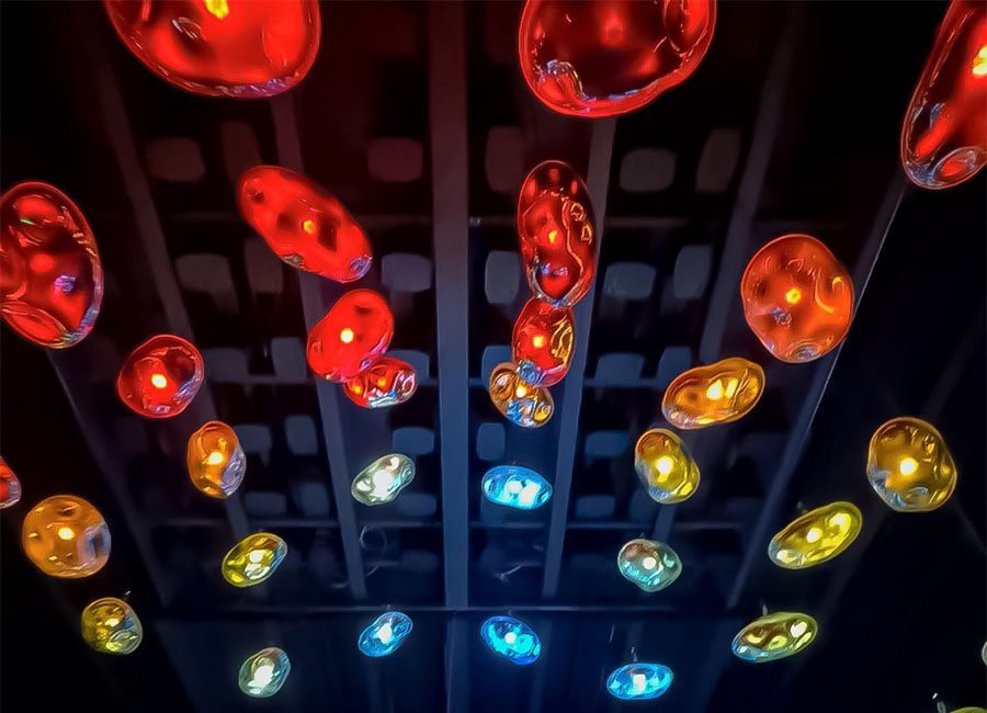 red and blue glass kinetic pendants