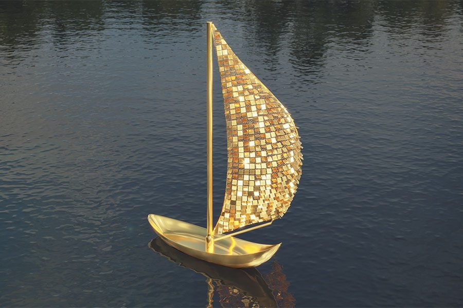 gold metal art feature on the water
