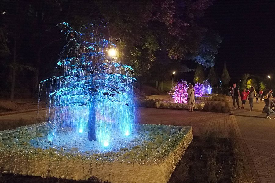 outdoor metal art feature with light
