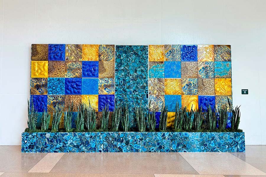 Decorative wall installation with custom glass and stone