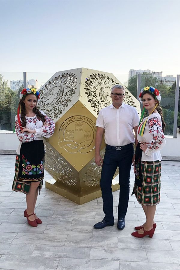 Branded metal art installation with perforated patterns