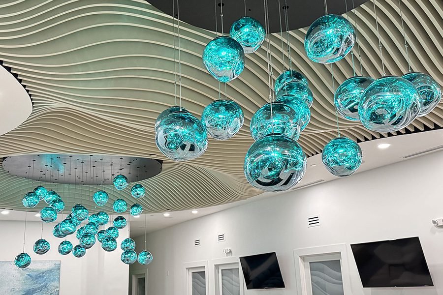 kinetic glass orbs hanging from the ceiling