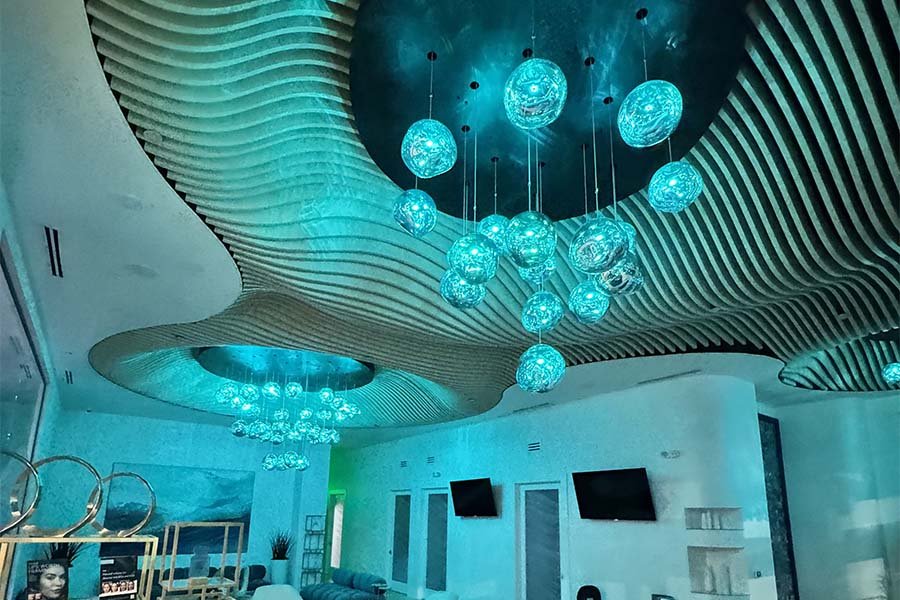 sculptural ceiling with glowing glass spheres