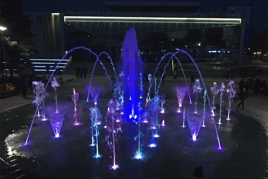 Interactive LED water fountain at night