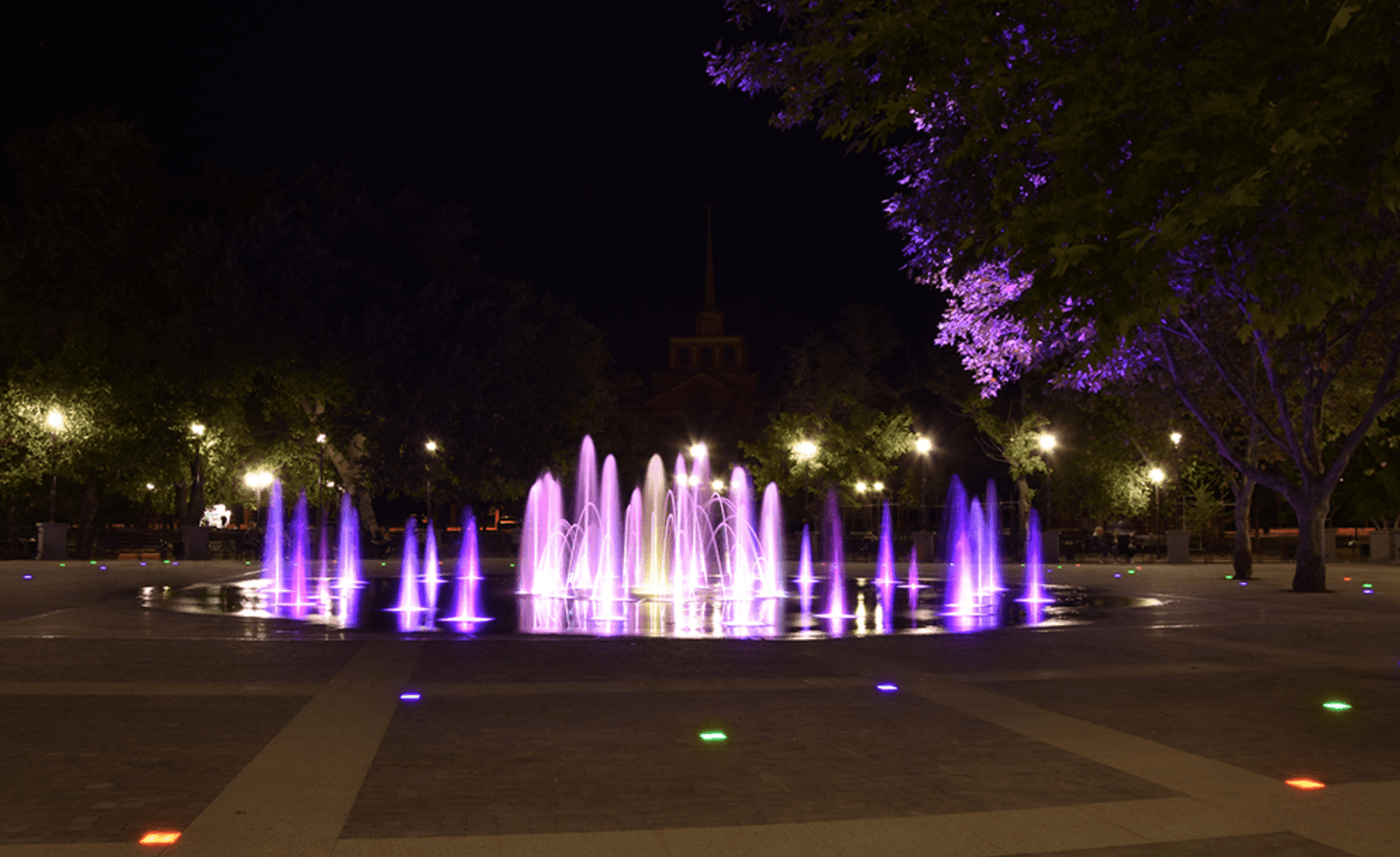 Architectural public fountain with LED-illuminated water jets