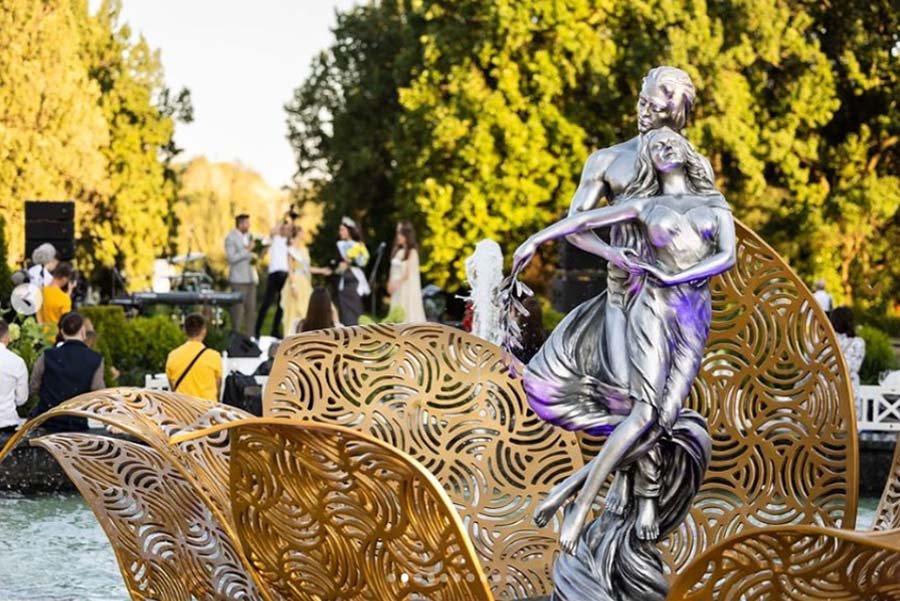 silver sculpture with gold perforate metal art installation