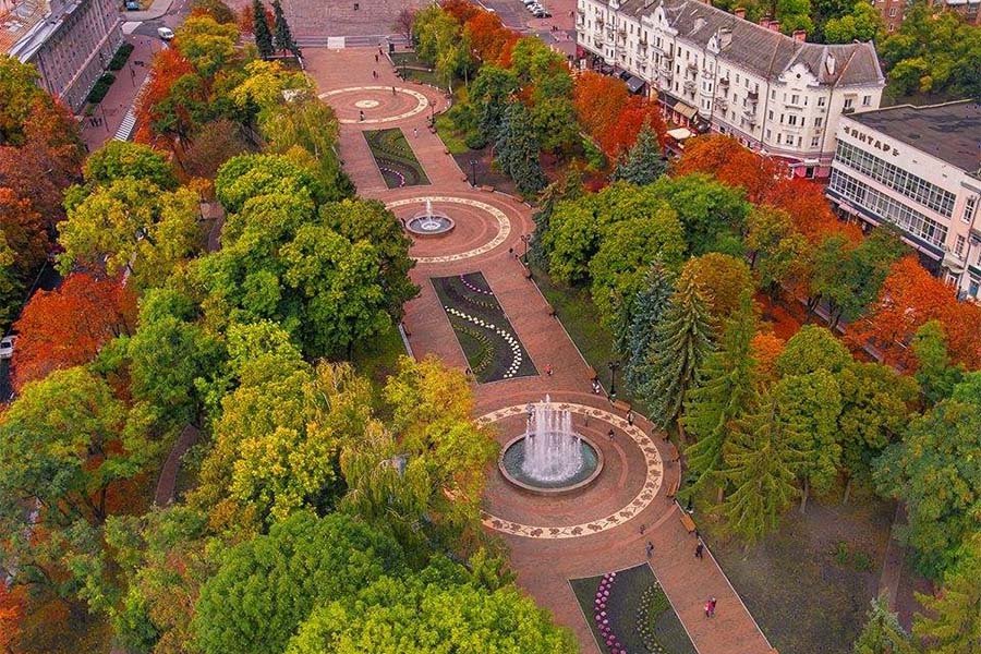Aerial view of landscaped park with decorative fountains