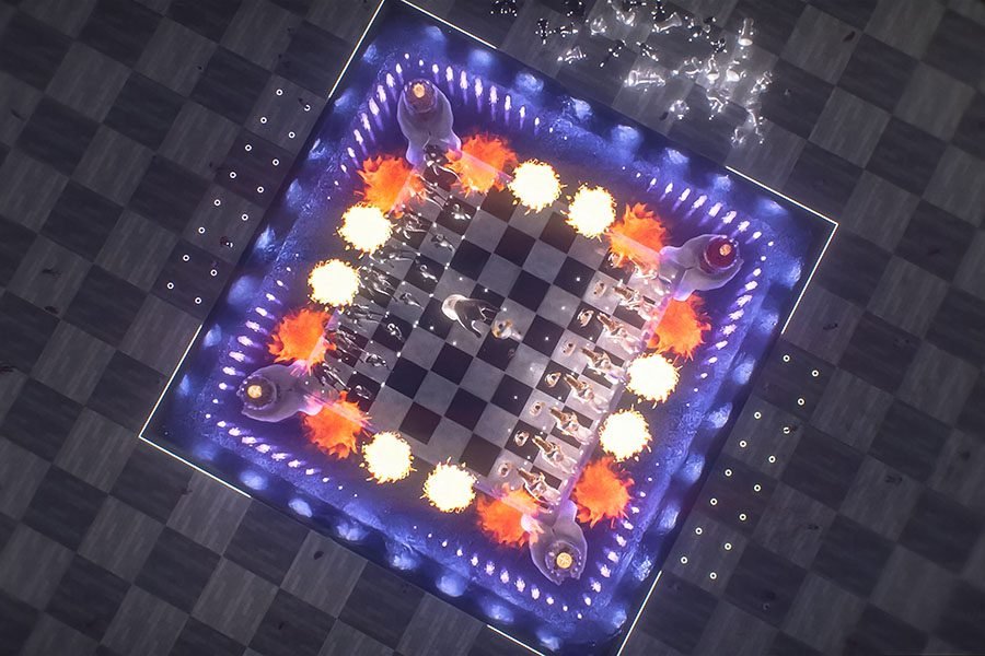 large outdoor fountain with chess figures and lighting