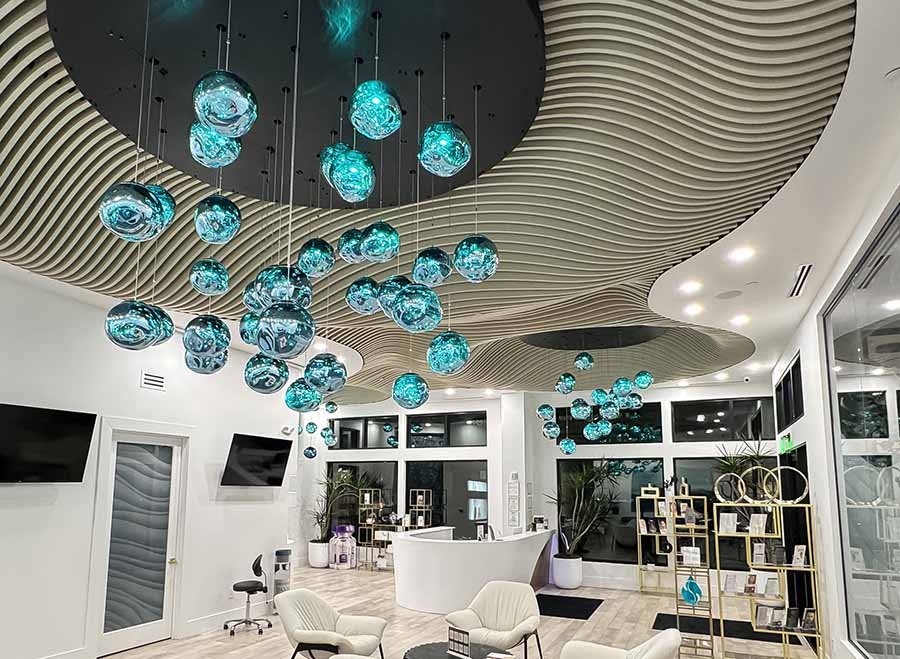 uspended turquoise glass light spheres in a modern spa interior