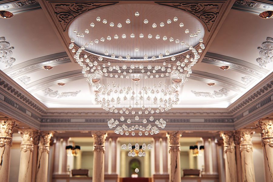 Kinetic chandelier with suspended crystal droplets