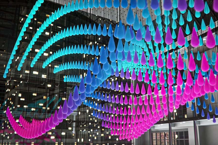 Colorful suspended droplet kinetic sculpture