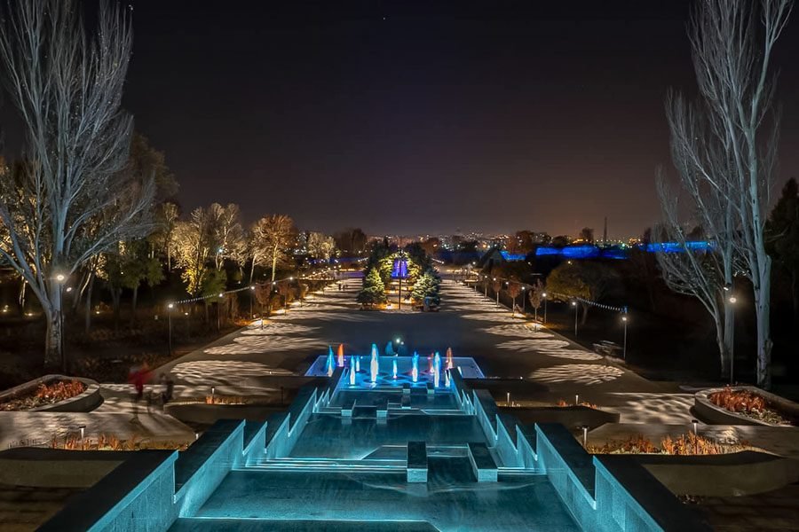 illuminated stepped fountain in park at night