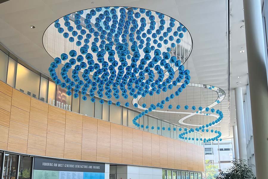 Suspended blue kinetic sculpture