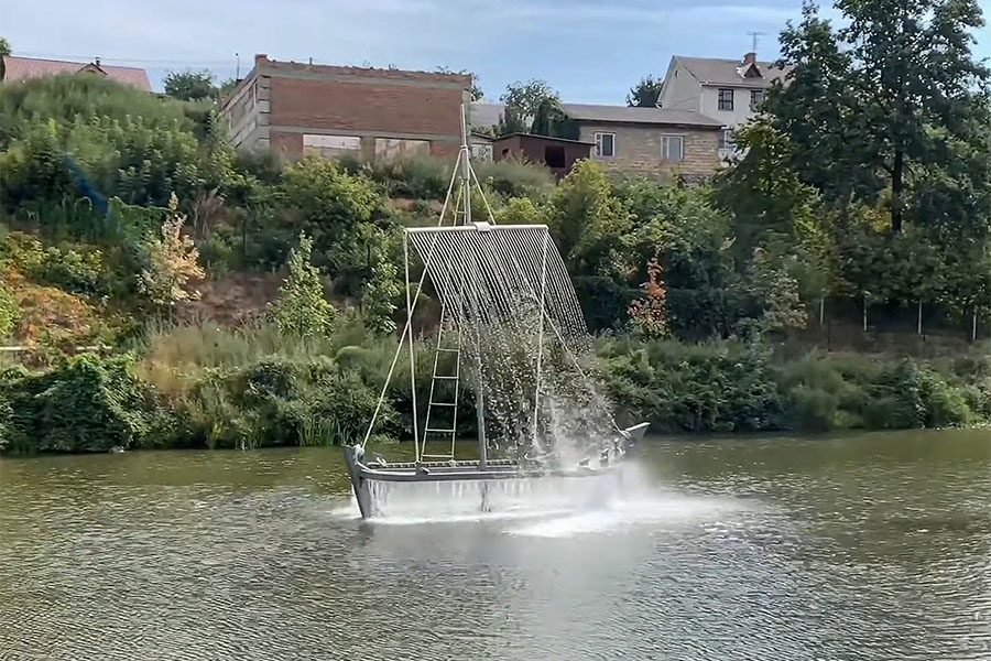 boat sculpture with fountain