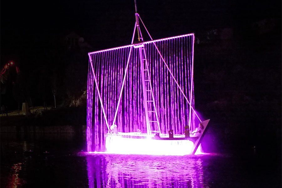 light and water art feature in the lake