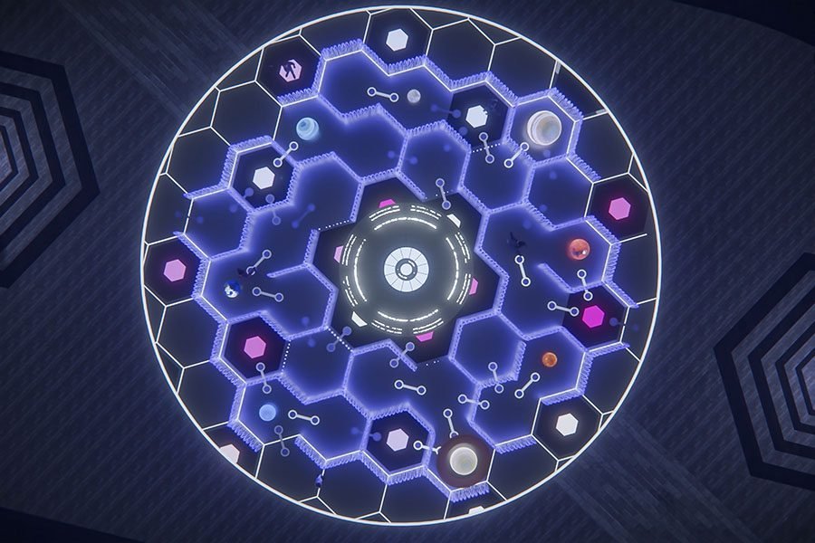 planet-themed fountain at night