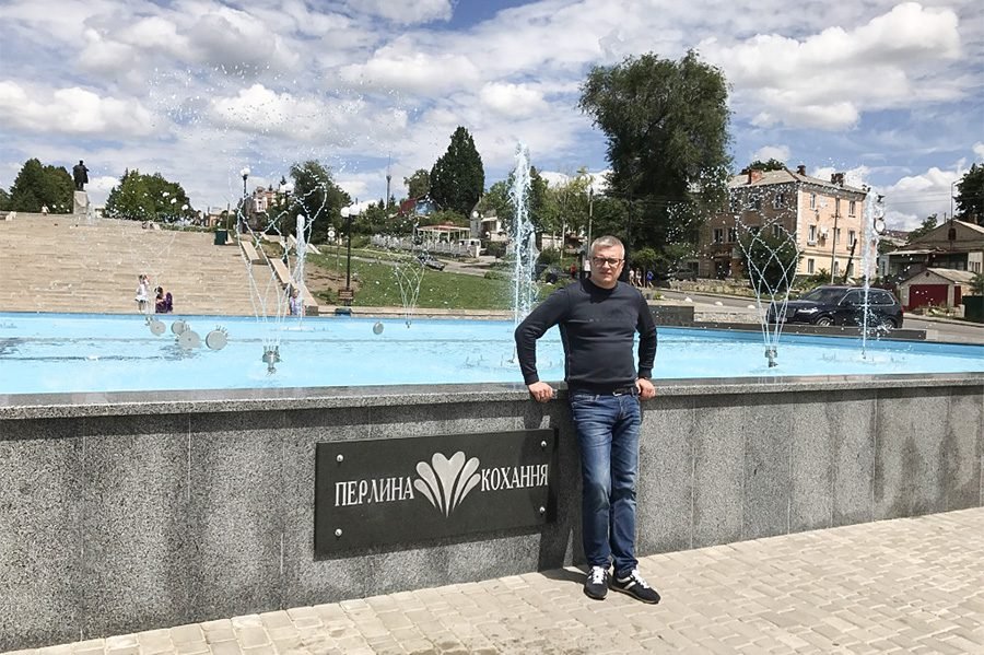 person in front tof fountain