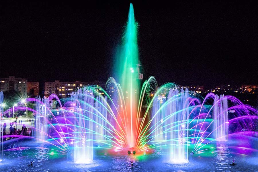 Colorful musical fountain show with LED lighting at night