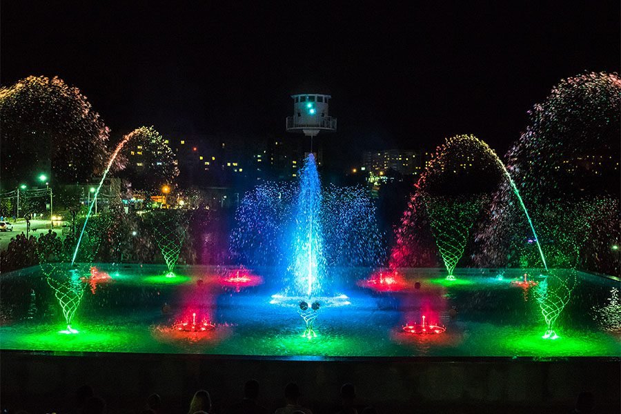 Colorful musical fountain with LED choreographed water show at night