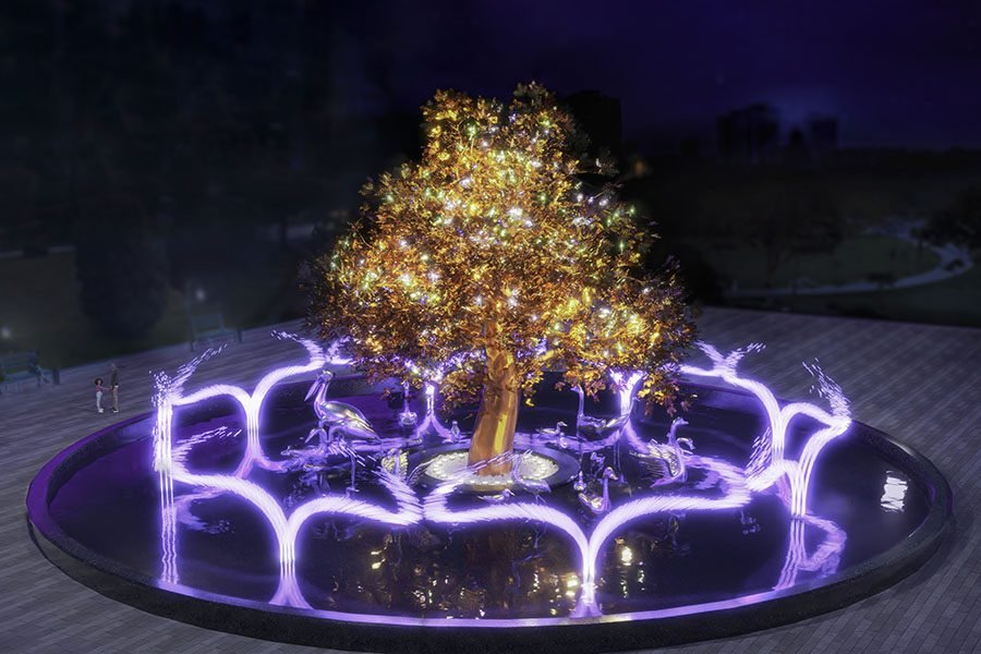 golden tree fountain with illuminated water arcs