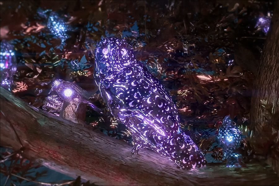 illuminated owl art sculpture in fantasy tree
