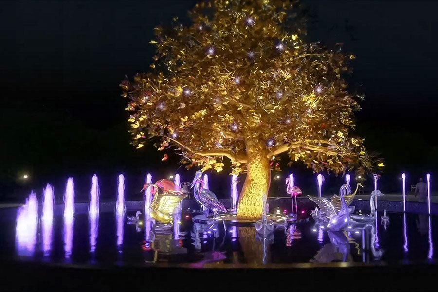 golden tree fountain with metallic bird sculptures
