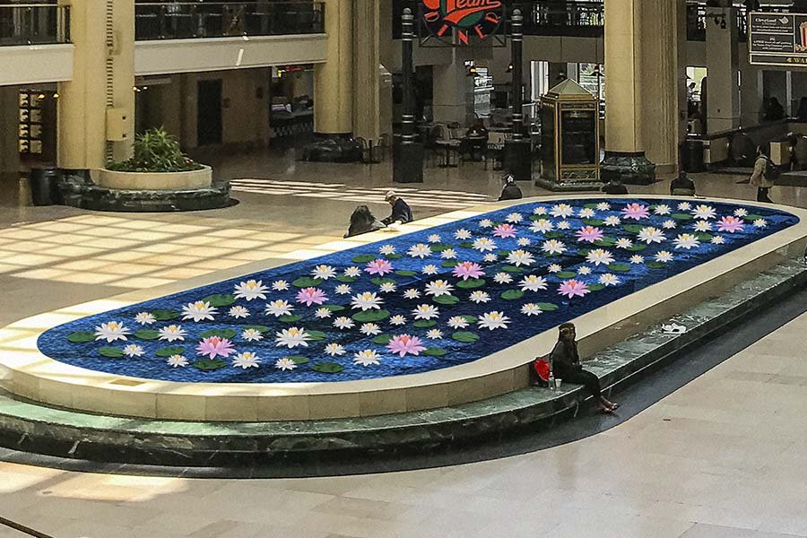 interior water fountain with floral art inside and integrated stone benches
