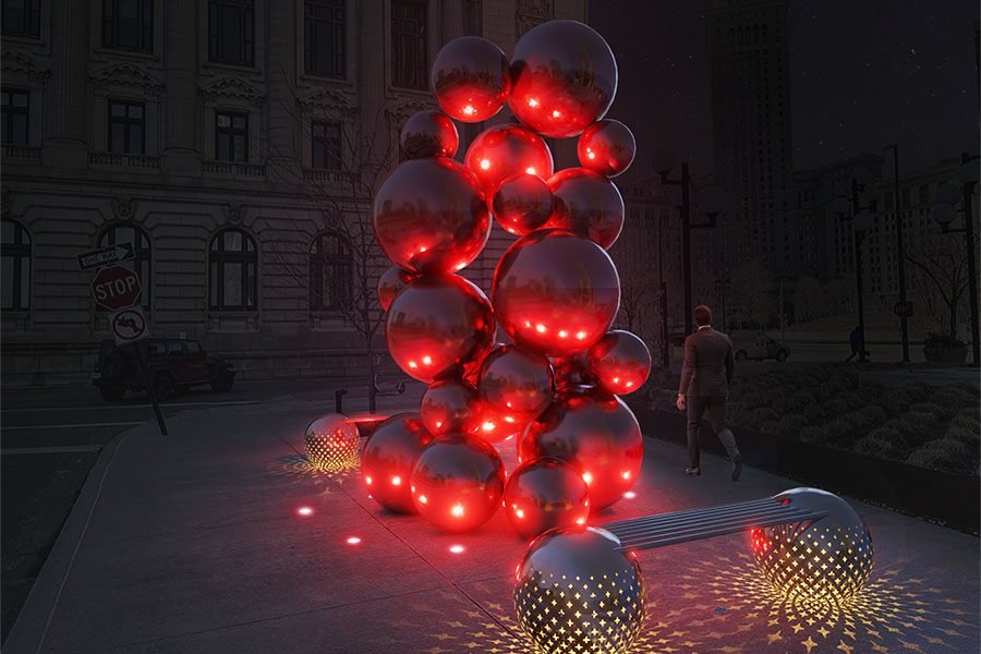 Illuminated red stainless-steel sphere sculpture in urban plaza
