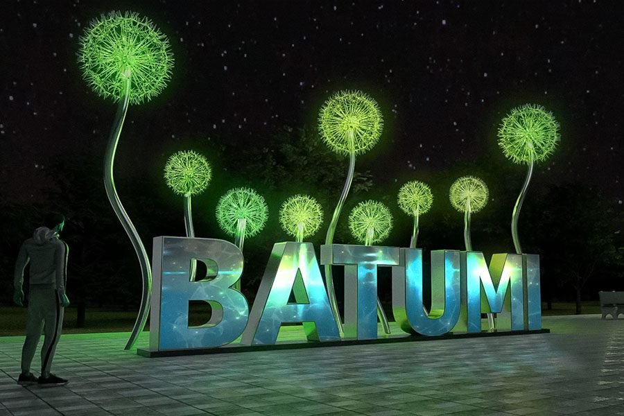 interactive outdoor light sculpture with dandelions and Batumi sign