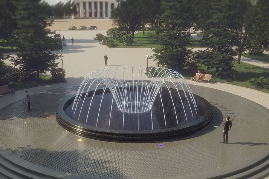circular water feature with light in outdoor park setting