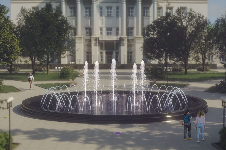 lighted round fountain in large city park water feature