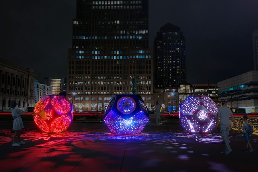 branded colorful illuminated polyhedron art installation with projected shadows