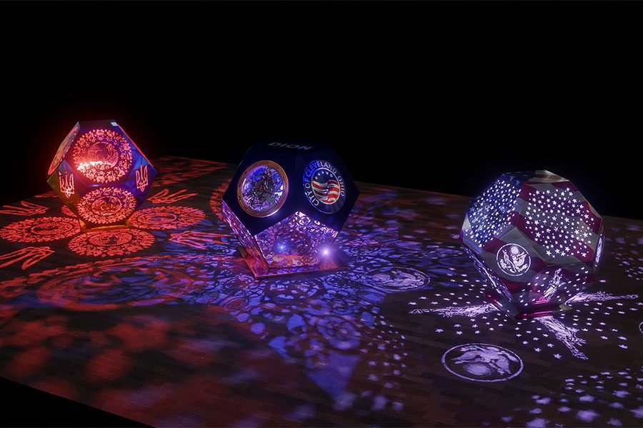 glowing perforated art sculptures with LED in city plaza