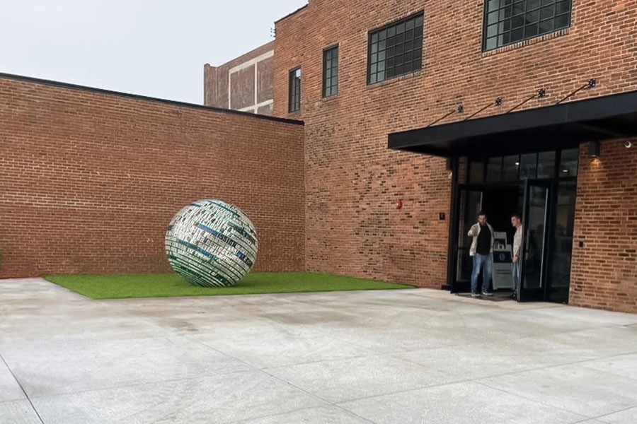 perforated metal text sphere outdoor installation
