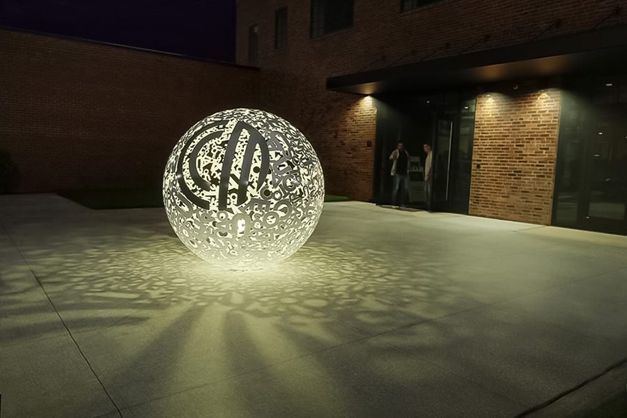 illuminated perforated metal sphere public art