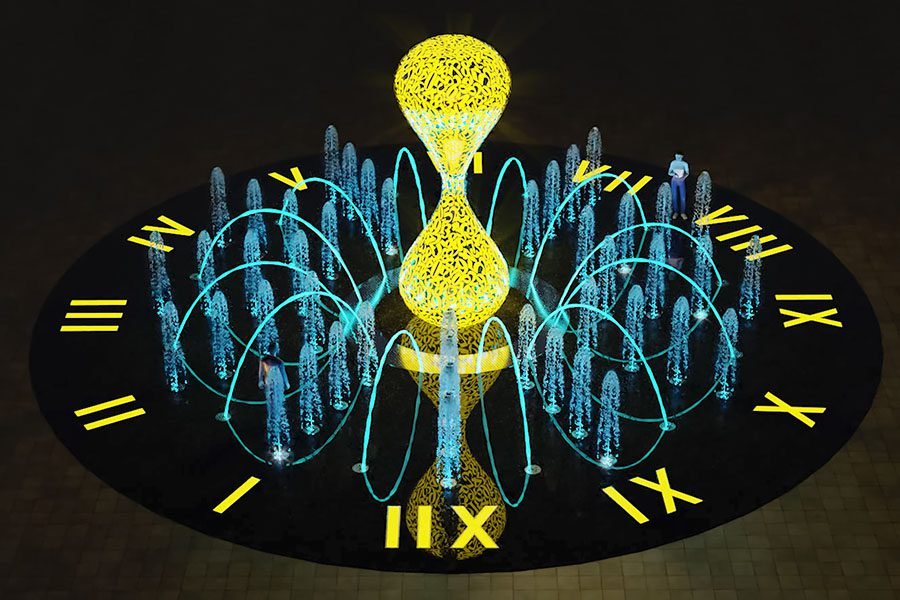 illuminated hourglass timepiece in round night fountain installation