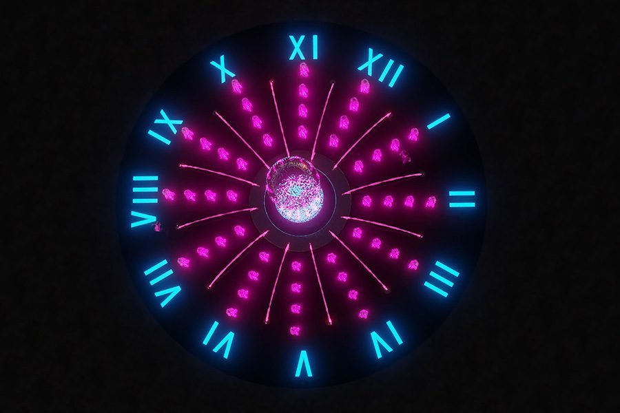 clock fountain with red and blue light