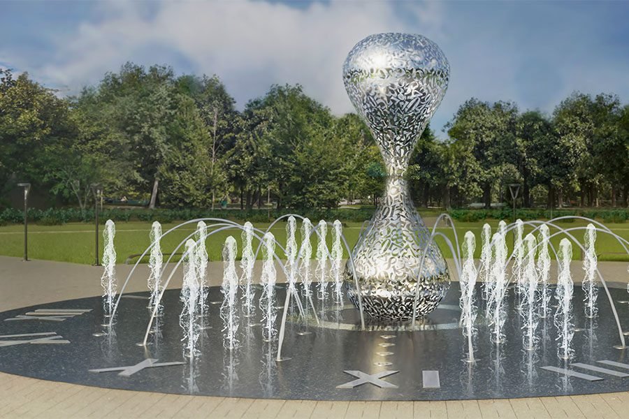 silver metal clock fountain in city park