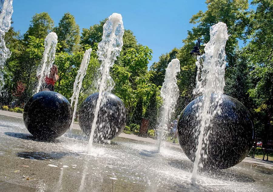 Park fountain with stone spheres and LED water jets