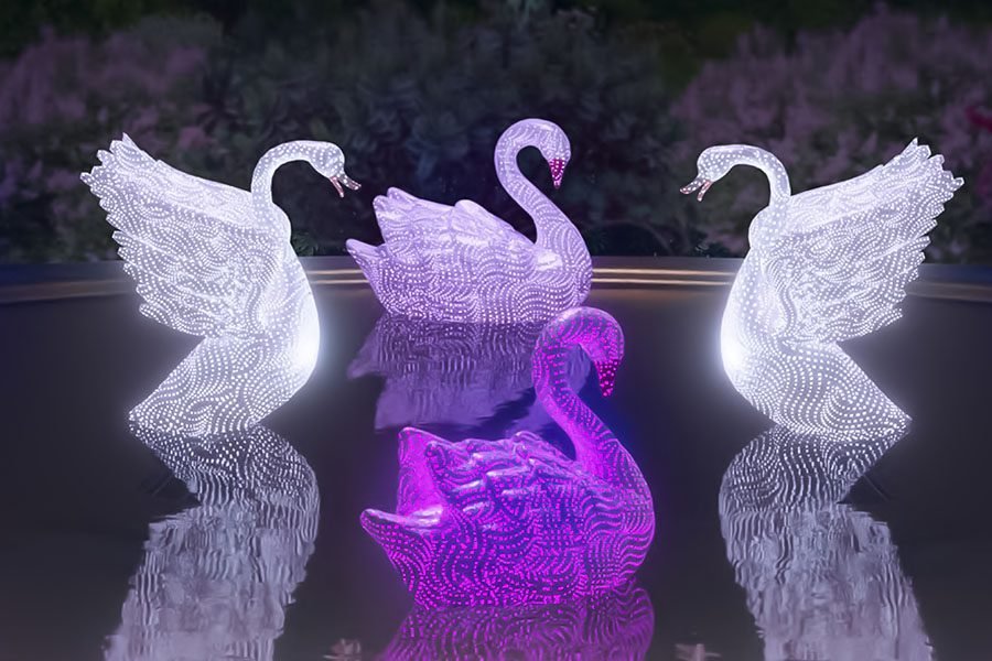 outdoor water feature with swans and surrounding fountain